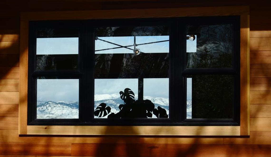The Boise Foothills are visible through the front and back windows of the house.