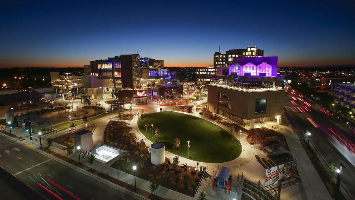The finished Jack’s Urban Meeting Place, or JUMP, glows at night in the Downtown Boise skyline. The J.R. Simplot Co.’s new headquarters is in the background.