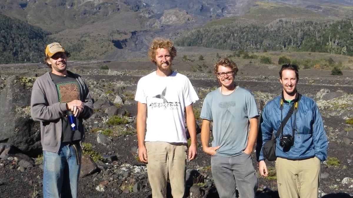Four Boise State researchers pose in front of Volcan Villarrica in Chile a couple of weeks after it erupted last year. From left: Jeffrey Johnson, associate professor of geosciences; Jordi Johnson, field assistant; Tim Ronan, a 2014 bachelor’s degree graduate in geophysics; and Dylan Mikesell, assistant professor of geophysics.