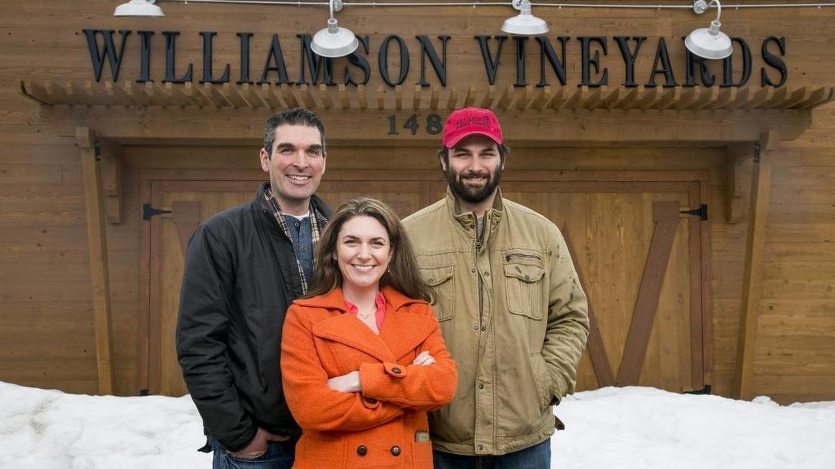 Siblings Mike and Beverly Williamson and cousin Patrick in front of the Williamson Vineyards tasting room. “Mike and Pat and Beverly are doing the management,” said Roger Williamson, who ran the business with his brother John until these children took over. “We’re providing some of the money.”