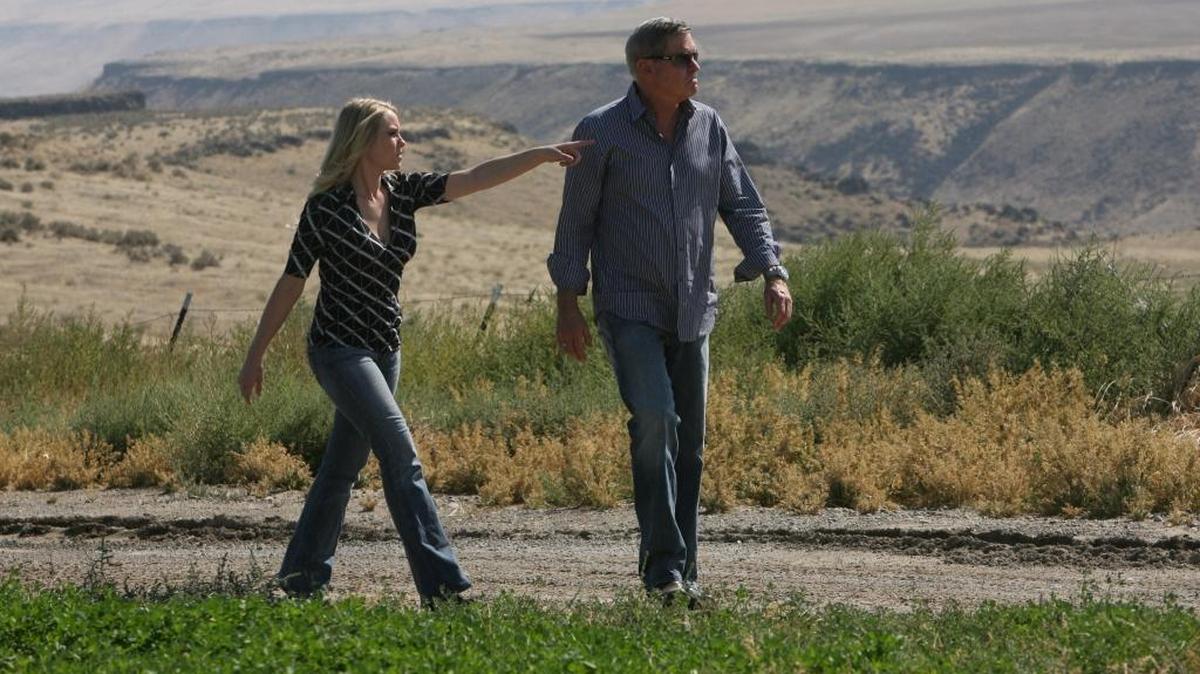 Don Gillispie, CEO and chairman of Alternate Energy Holdings Inc., and Vice President Jennifer Ransom walk in 2008 along the boundary of property southeast of Mountain Home where the company once proposed building a nuclear power plant.