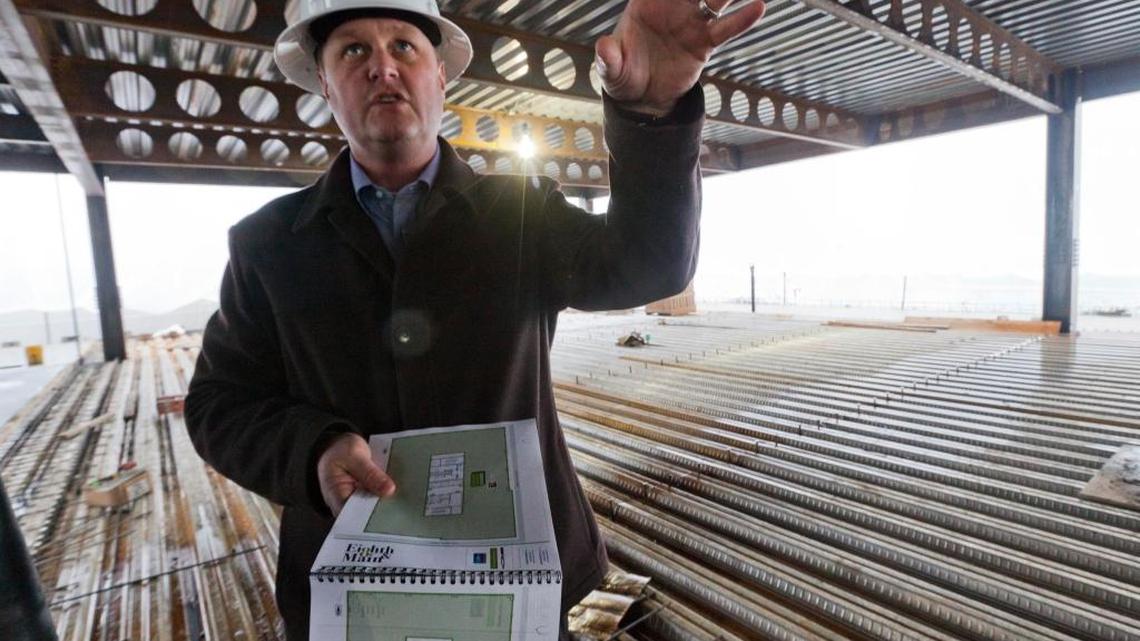 Tommy Ahlquist with Gardner Co., the 8th & Main project developer, explains how the building will be organized during a tour of its construction Jan. 8, 2013.