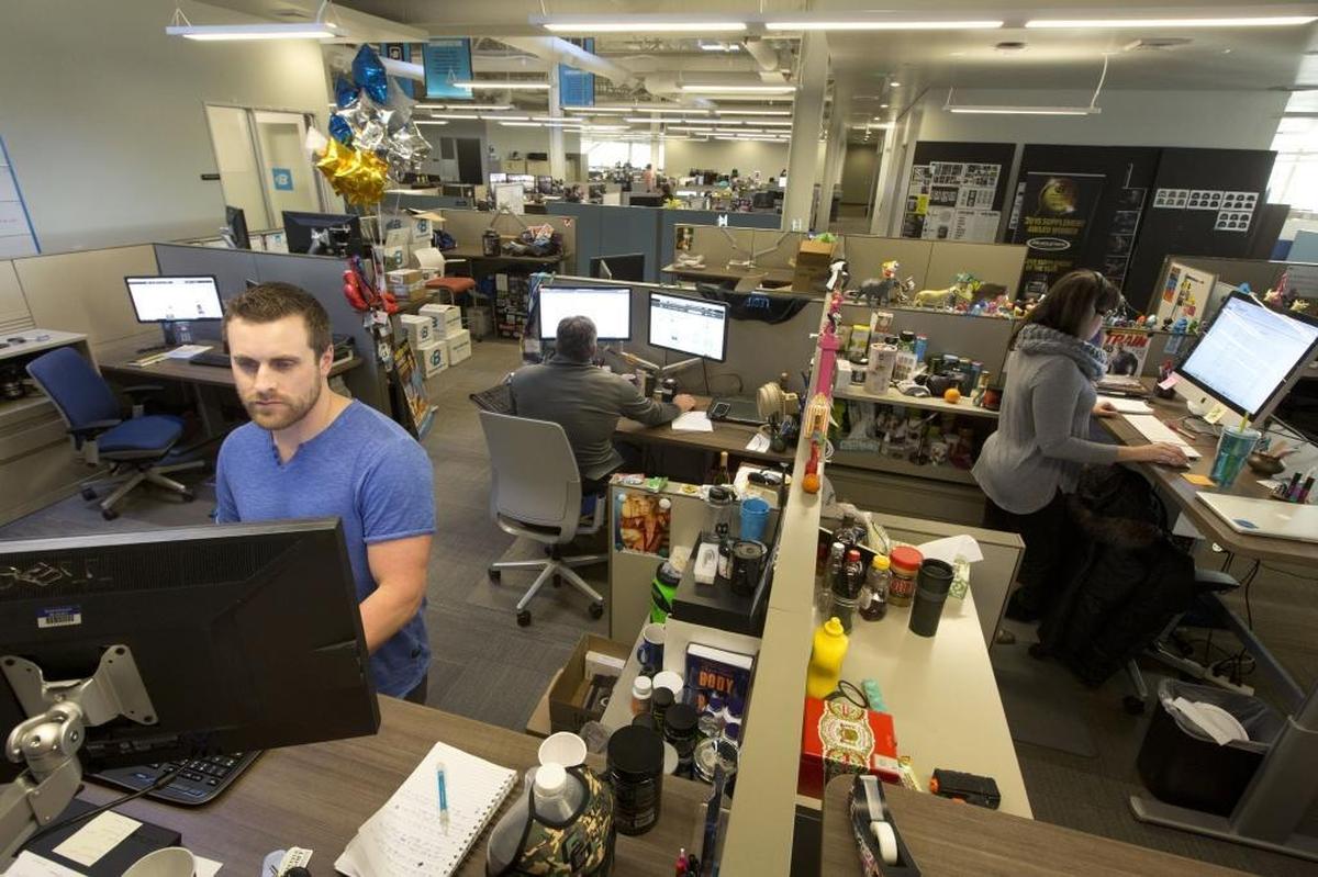 Kirk Calzacorta, a senior manager in the offline marketing department, works in 2015 at Bodybuilding.com’s headquarters at 5777 N. Meeker Ave.