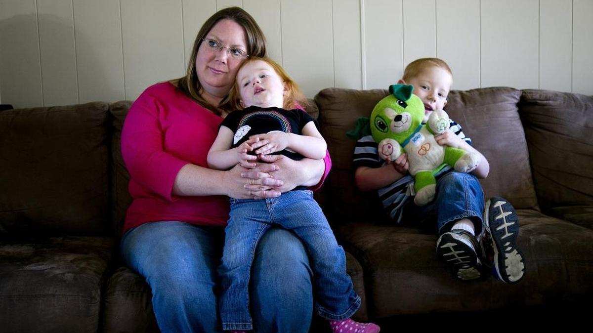 Shannon Murray watches TV at her Nampa home with 4-year-old son Cameron, right, and 2-year-old daughter Jemma. Murray filed a complaint with the Idaho Department of Insurance after waiting weeks for a tax form she was due from the Your Health Idaho insurance exchange.
