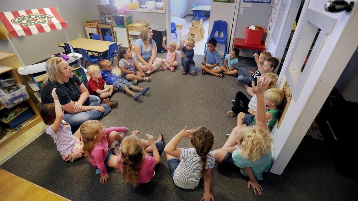 Students at Kids Korner preschool start the day with circle time. The students are given a chance to talk about their activities the day before. Instructors also outline what students will be doing the rest of the day. (Monte LaOrange/The Post-Register via AP)