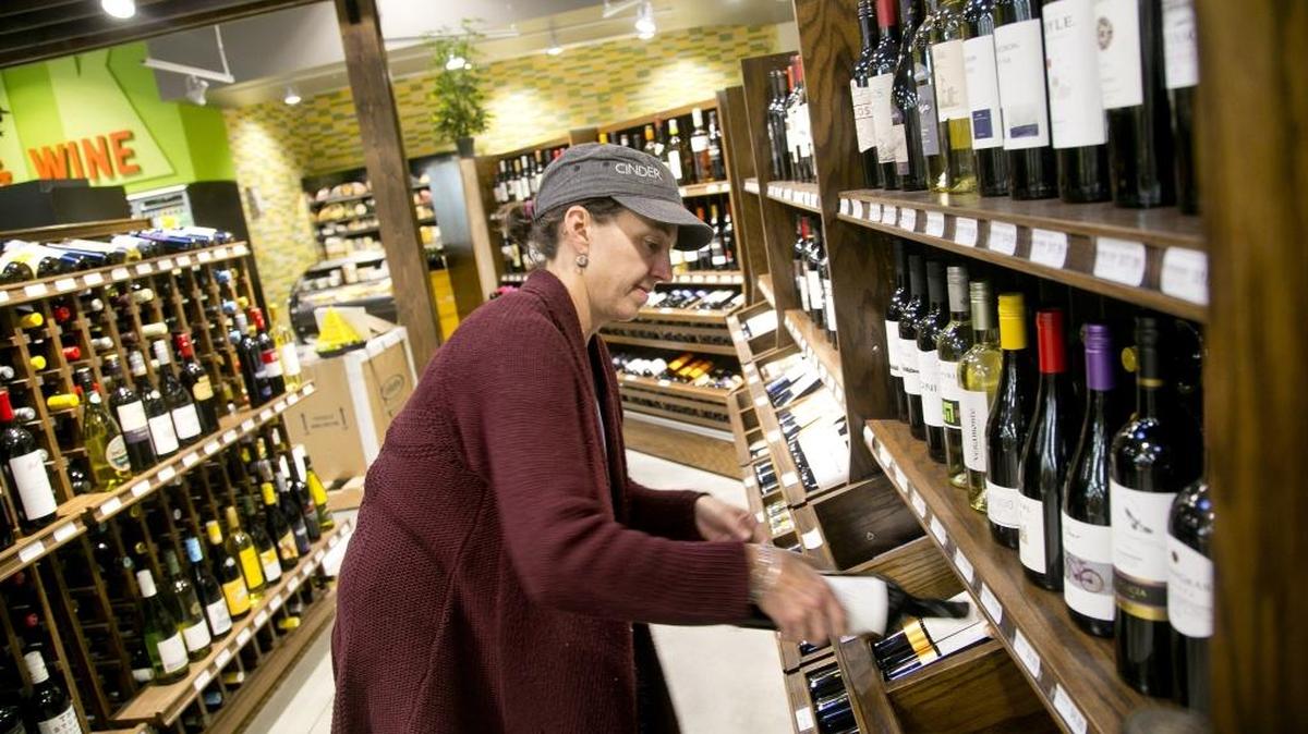 Marcy French, wine and beer lead for the Boise Co-op, stocks some of the more than 800 different wines that will be available at the soonto be opened store in Meridian. The Co-op’s second location is set to open at the Village at Meridian on Nov. 13.