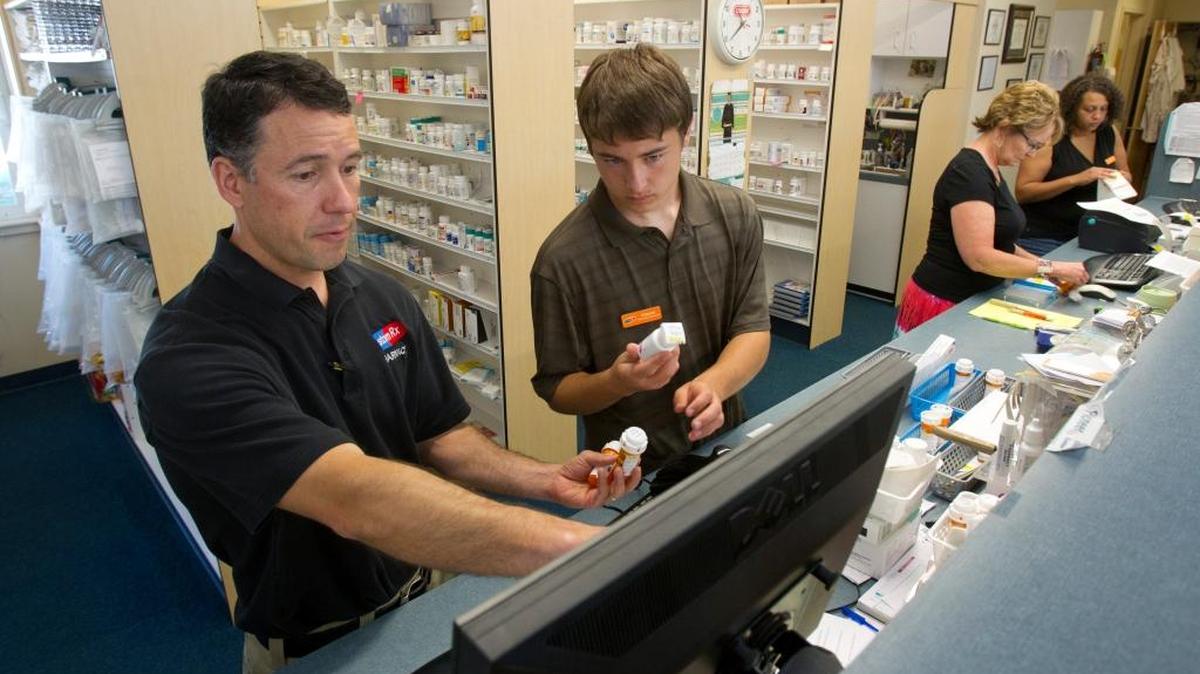 Employees work at Custom RX Pharmacy in Kuna in this Statesman file photo.