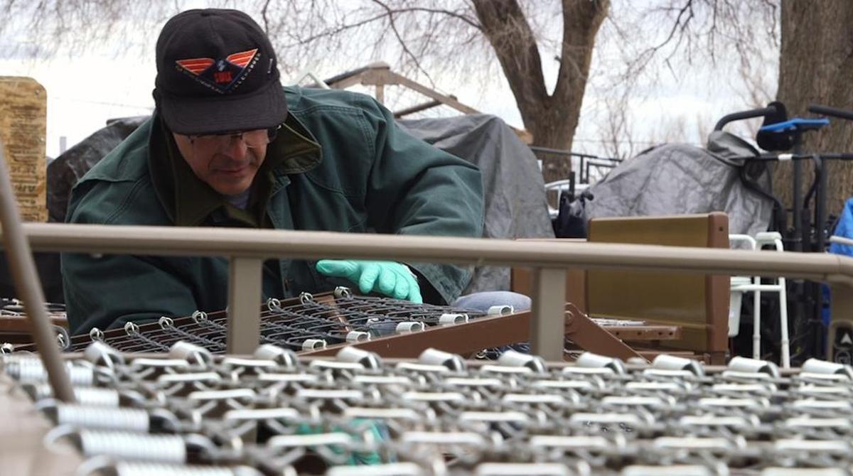 Hospital beds are in great demand at the Knights of Columbus Medical Equipment Loan Program. Volunteer Allen Baxter of Boise cleans a donated bed in preparation for loaning it out. All that is asked is that they are returned when they are no longer needed.