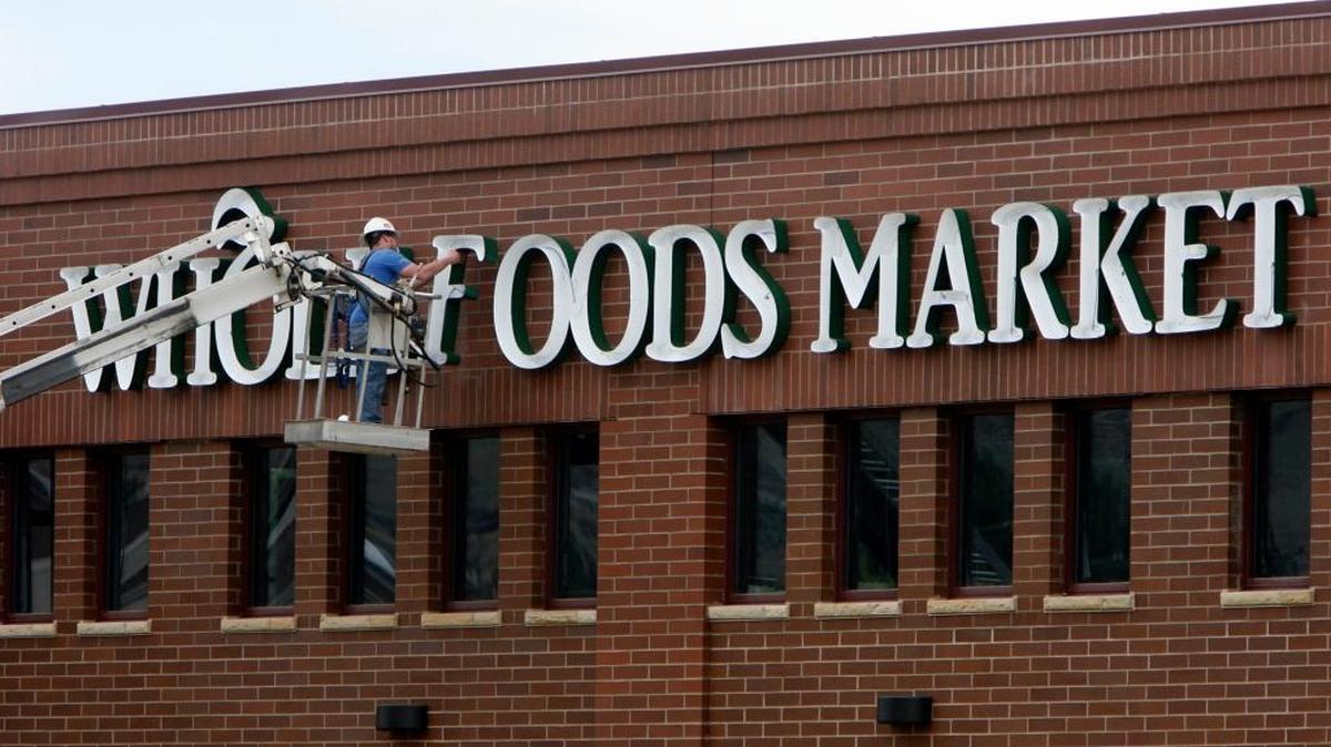 It was less than five years ago that Whole Foods opened its first and only Treasure Valley store at Front Street and Broadway. Now the chain is struggling, and Boise’s Albertsons chain is considering buying it, a financial newspaper reports. A worker readies the sign on the Boise store in June 2012.
