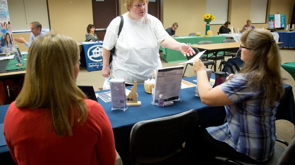 Linda Farr, center, visits with Erin Floyd, left, and Michele Babbitt, recruiters with the Idaho Department of Health and Welfare, on the first day of a four-day job fair in Caldwell. A dozen health care employers spoke with job-seekers on Monday. Farr, who is unemployed, noted that Canyon County has a low rate of joblessness. “OK,” she said, “there’s a chance for me.”
