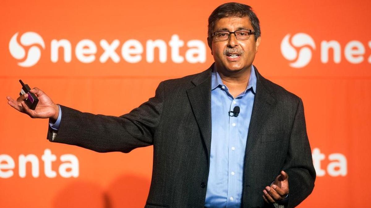 SanDisk CEO Sanjay Mehrotra speaks at the Nexenta OpenSDx Summit in 2014, in San Francisco. He grew up mostly in Delhi, India. Under his presidency, SanDisk focused on making more robust and reliable memory chips.