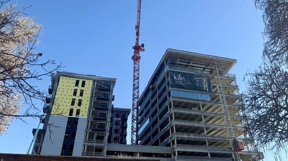 The Bannock towers under construction on Dec. 3. The developer expects the building to open in summer 2026.