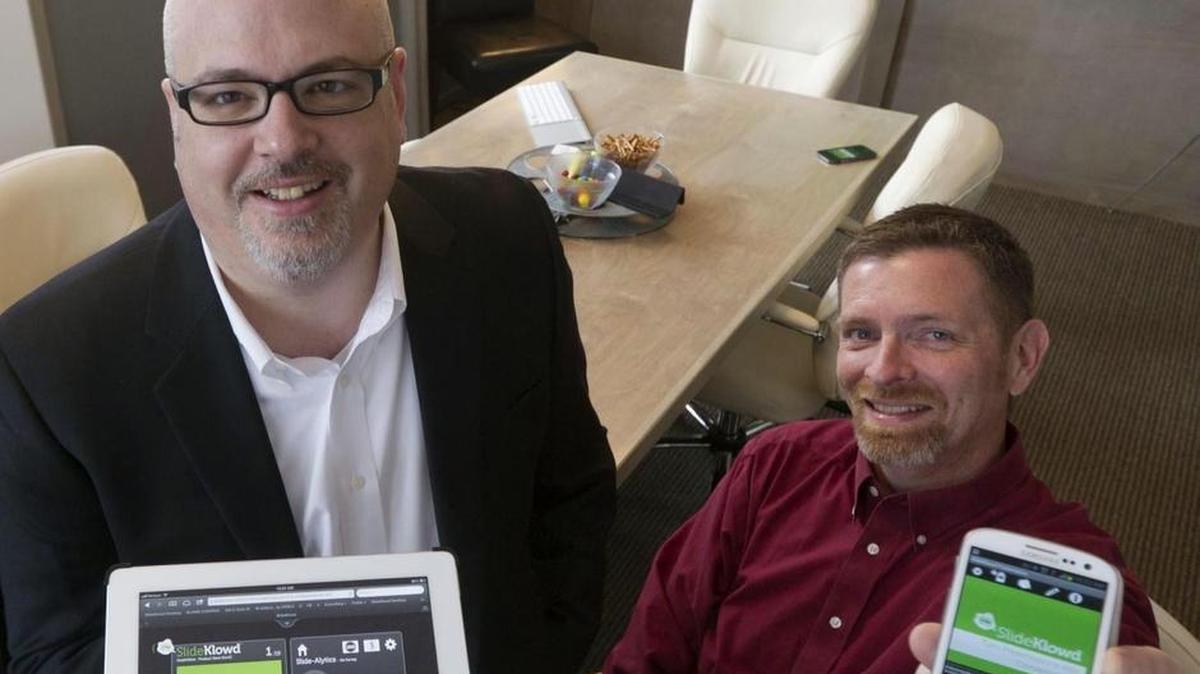 Klowd.com CEO Ken Holsinger, left, started the company with Justin Foster, who is no longer with the company, and Casey McMullen, right, director of digital-solution development. Holsinger said the SlideKlowd feedback app was inspired by a Boise State game he attended in 2010: “We could combine mobile technology with the power of crowd emotion and crowd motivation.”