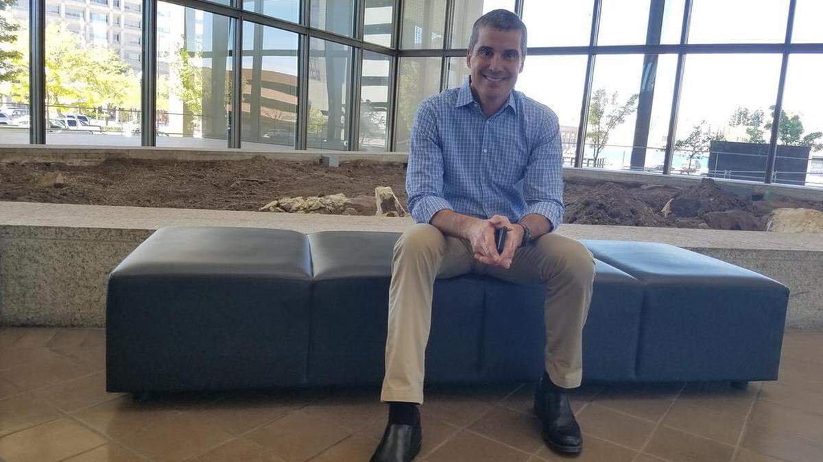 Scott Schoenherr, a partner in Rafanelli & Nahas, a Boise commercial real estate development and management company that owns the Boise Plaza, sits in front of one of four planters being torn out as part of a $1.1 million lobby renovation.