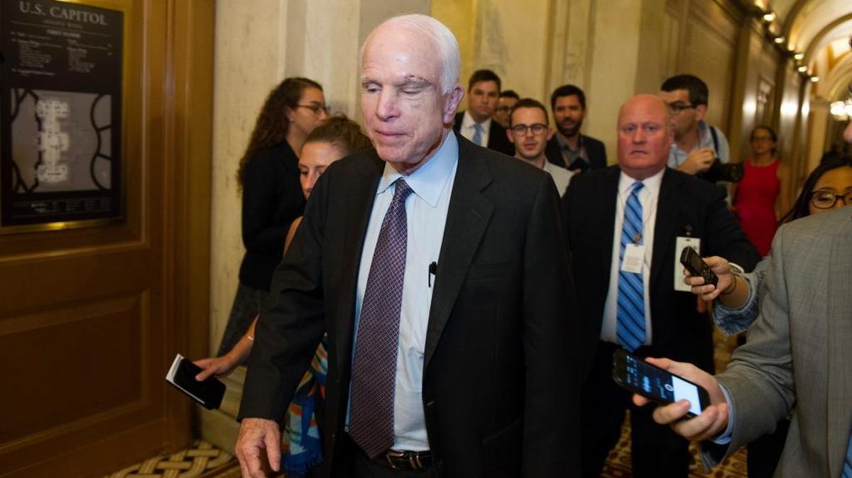 Sen. John McCain, R-Arizona, is pursued by reporters July 28, 2017, after casting a ‘no’ vote on a measure to repeal parts of former President Barack Obama’s health care law.