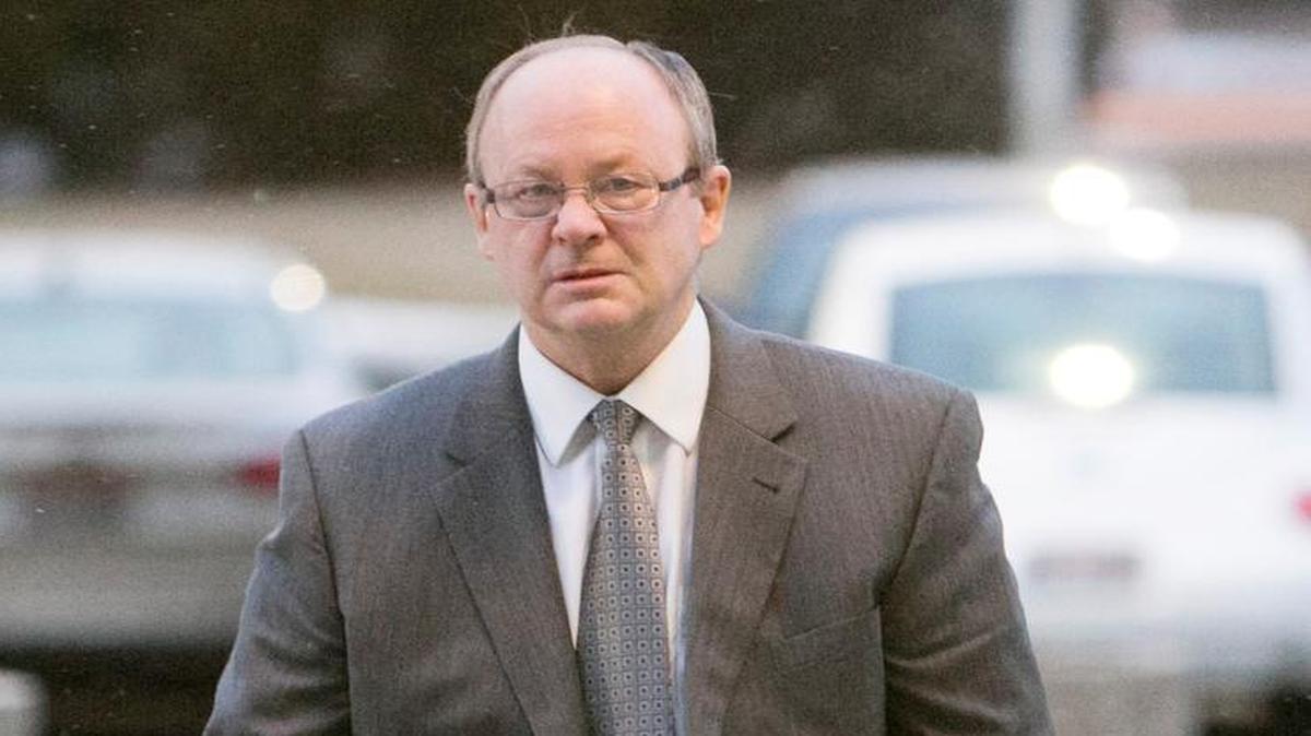 Douglas L. Swenson, DBSI's president, makes his way into federal court in Boise during the 2014 federal trial of four top executives of the failed property investment giant DBSI.