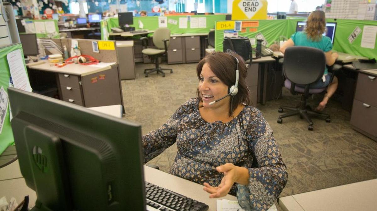 DirecTV customer service representative Ann Marie Lybarger takes an incoming customer call at the company’s Boise call center in this 2013 photo.