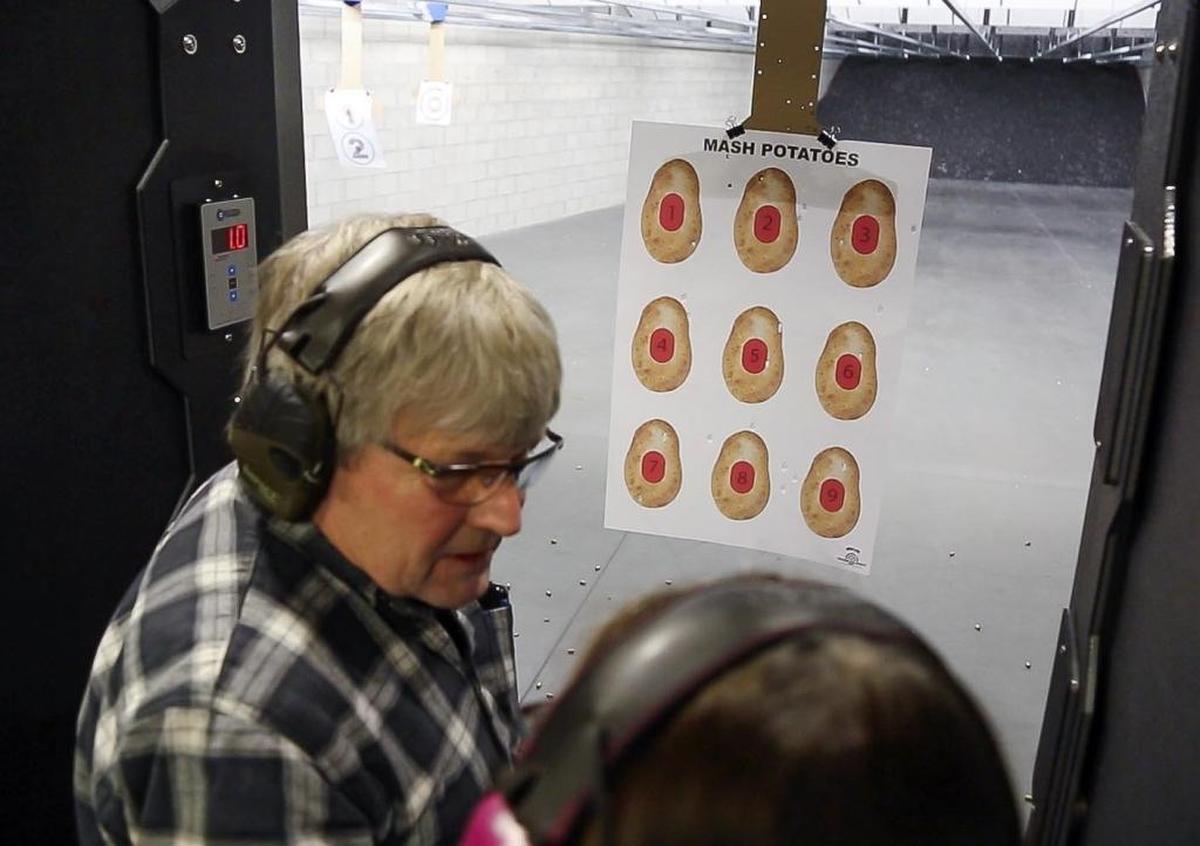 Bill and Regenia Wilson, of McCall, check their shooting accuracy on an Idaho-centric target at Independence Indoor Shooting Range.