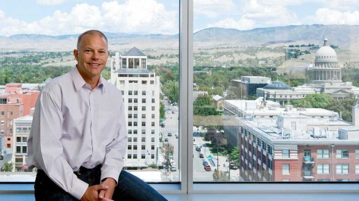 CEO Jerry Dunn pictured in his office Downtown office in the Eighth & Main building in August.