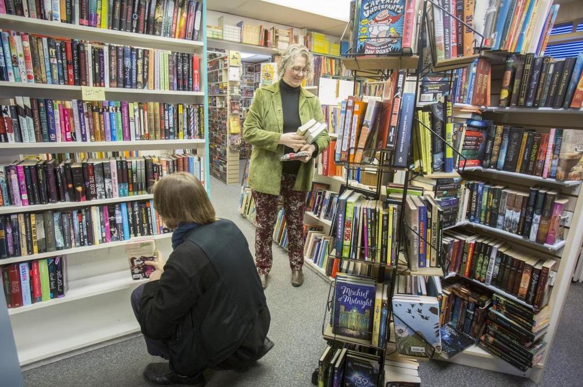 Bruce and Laura DeLaney, owners of Rediscovered Books, just purchased Rainbow Books, a used bookstore on State Street. Laura DeLaney and employee Ben Kemper helped reorganize shelves Thursday at Rainbow.