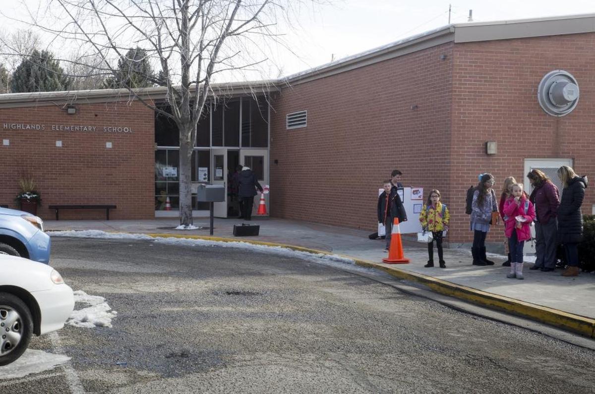 A debate has developed on what to do with the existing Highlands Elementary, built in 1961. Some people want to renovate it. Others say it is time to replace it with a modern school placed farther back on the lot, away from traffic and safety hazards.