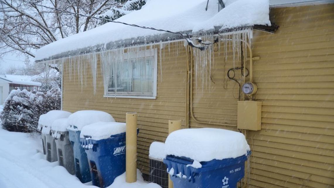 Ice dams form across the edge of a roof when hot air in an attic melts snow on the roof and the melting water reaches the edge of the roof, where it is much cooler. Water that hits the dam and has nowhere to go can seep under shingles and cause damage outside and inside a home.