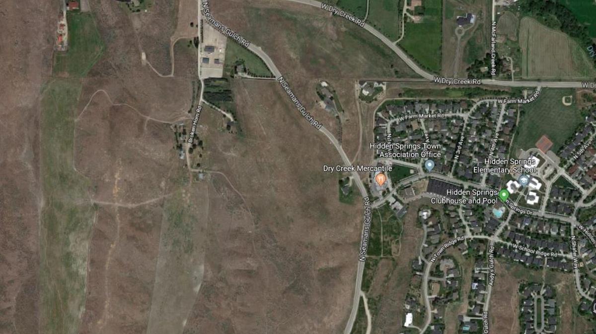 The two vertical green swaths on the left side of this photo are small valleys that are used as farmland. The land recently sold to a man who plans to subdivide the property to allow the construction of 13 new homes but preserve the farmland.