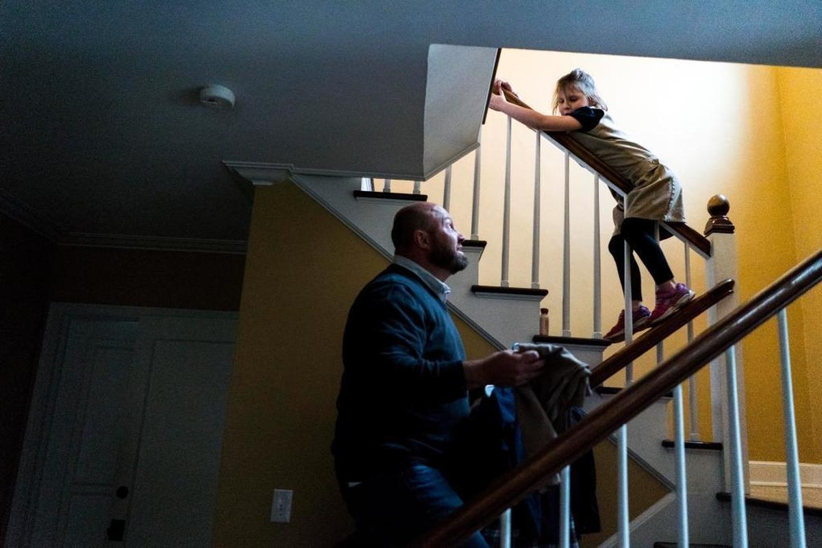 Rod Story at home with daughter Lucy, 7, in Moscow.