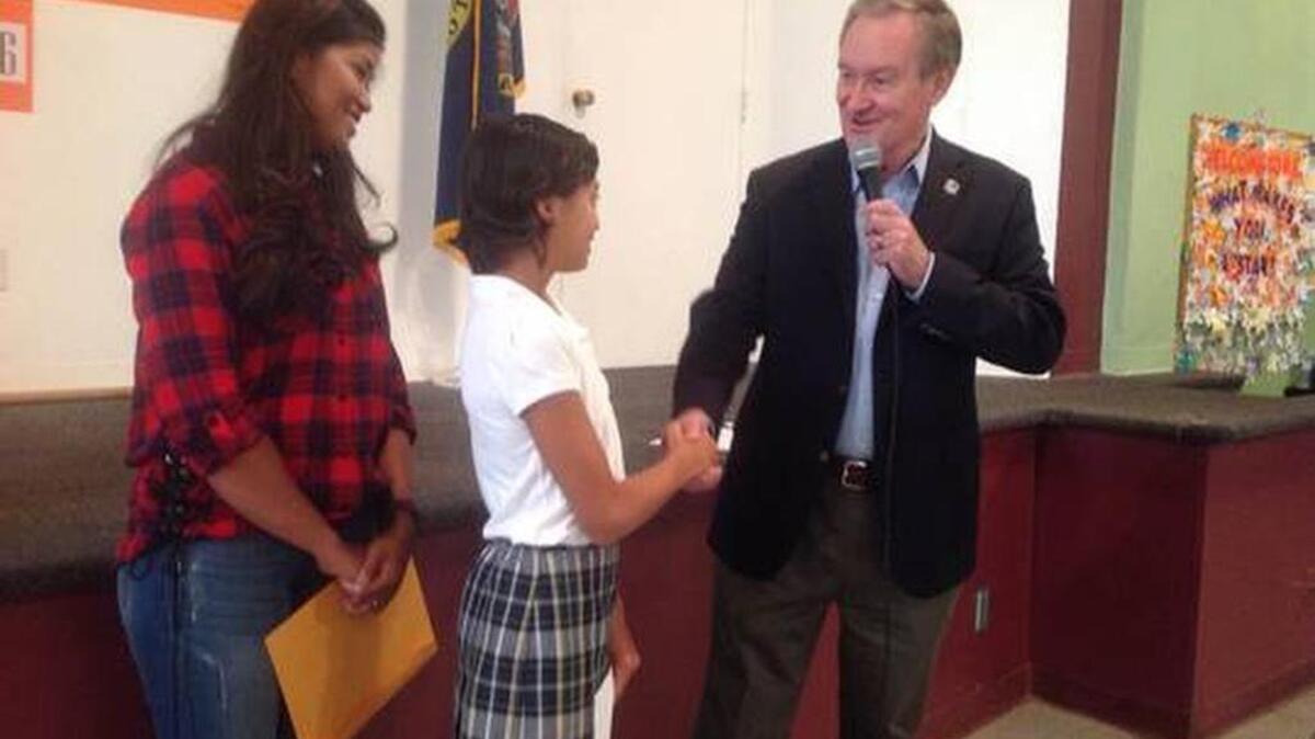 Sen. Mike Crapo congratulates Isabella Gerard, winner of a contest to light the U.S. Capitol Christmas Tree in Washington, D.C., this December.