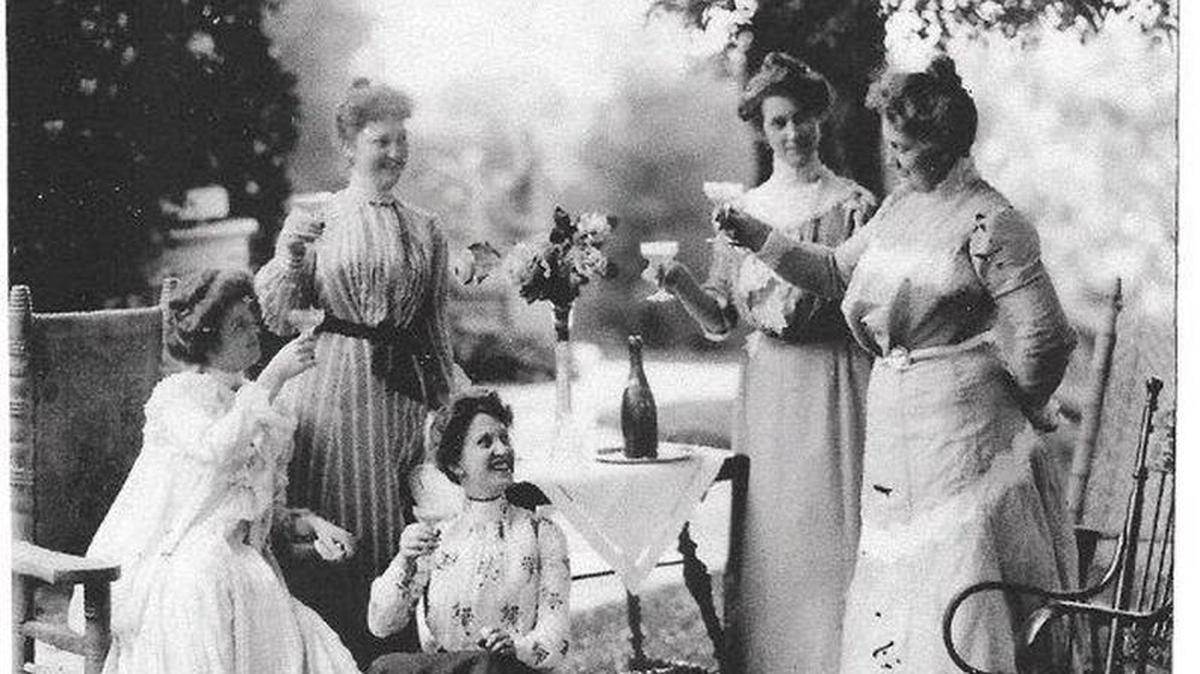 The Black sisters toast one another at the Boise home of Mary Black Ridenbaugh, second from right.