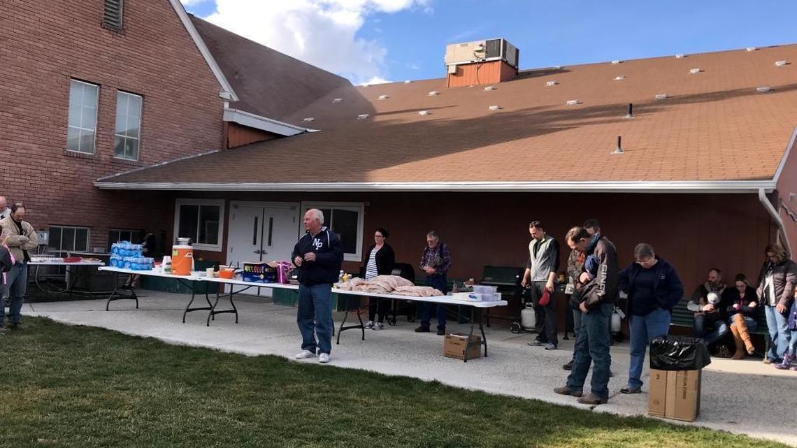 First Baptist Church Pastor Phil Pittman leads a prayer at a barbecue held at the church to support teachers and staff in the New Plymouth School District. Pittman was one of several residents, teachers and district staff to speak before a special meeting held in executive session of the school district’s board of trustees. Pittman is calling for Superintendent Kevin Barker to resign.