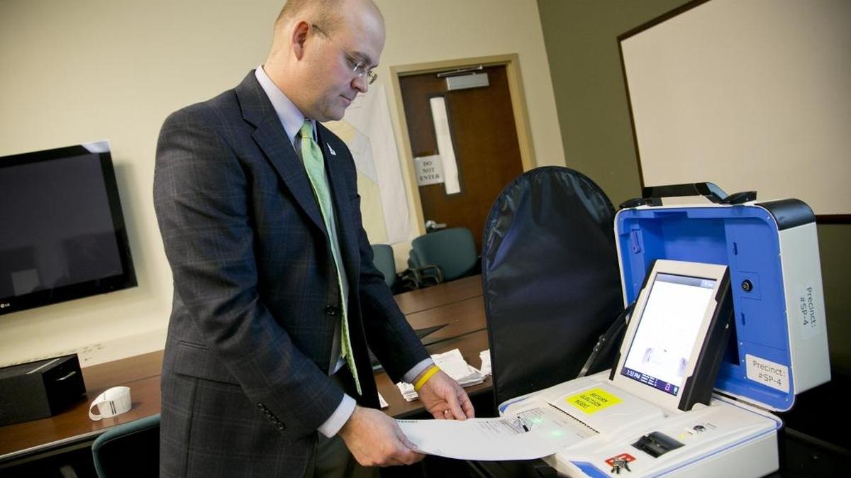 Ada County Deputy Clerk Phil McGrane demonstrates the new voting tabulation equipment at the county elections office in Boise. “The great part of the new equipment is it takes the best part of both worlds,” he said. “While we still use technology to tabulate the ballots ... we still use and retain the paper ballot.”