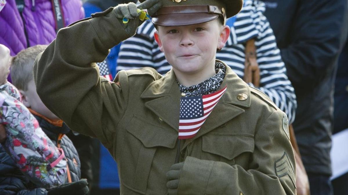 Milo Goss honors both his great-grandfathers by wearing their World War II Army uniforms. His maternal great-grandfather was Clair Kilton, one of the parade's grand marshals, who passed away on Oct. 31, just days before the parade. "It's neat to represent them," he said. "It feels nice." Boise honored veterans past, present and future at the annual Veterans Day Parade on Saturday, Nov. 4, 2017.