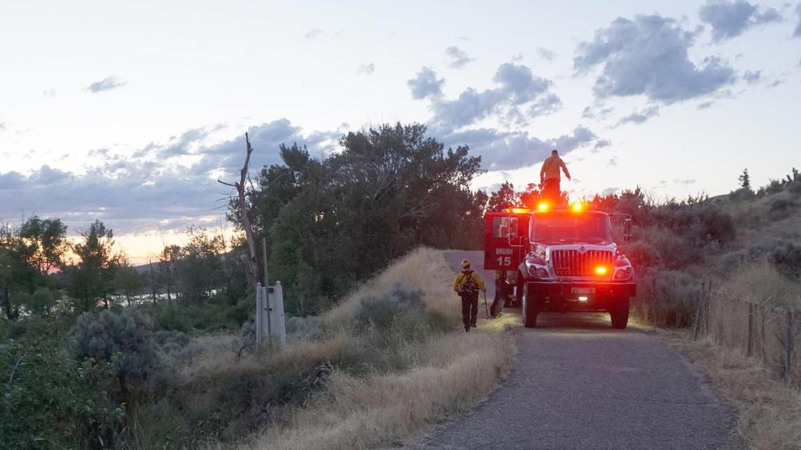 A Boise Fire engine needed to drive on the Boise River Greenbelt to reach a brush fire Tuesday night between the path and the river in East Boise.