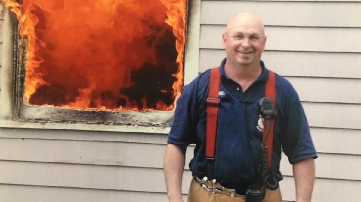 Michael McNeill stands outside a home on fire during a training session in an undated photo provided by the Boise Fire Department. “I saw that photo and it’s a great photo of him,” fire Chief Dennis Doan said.