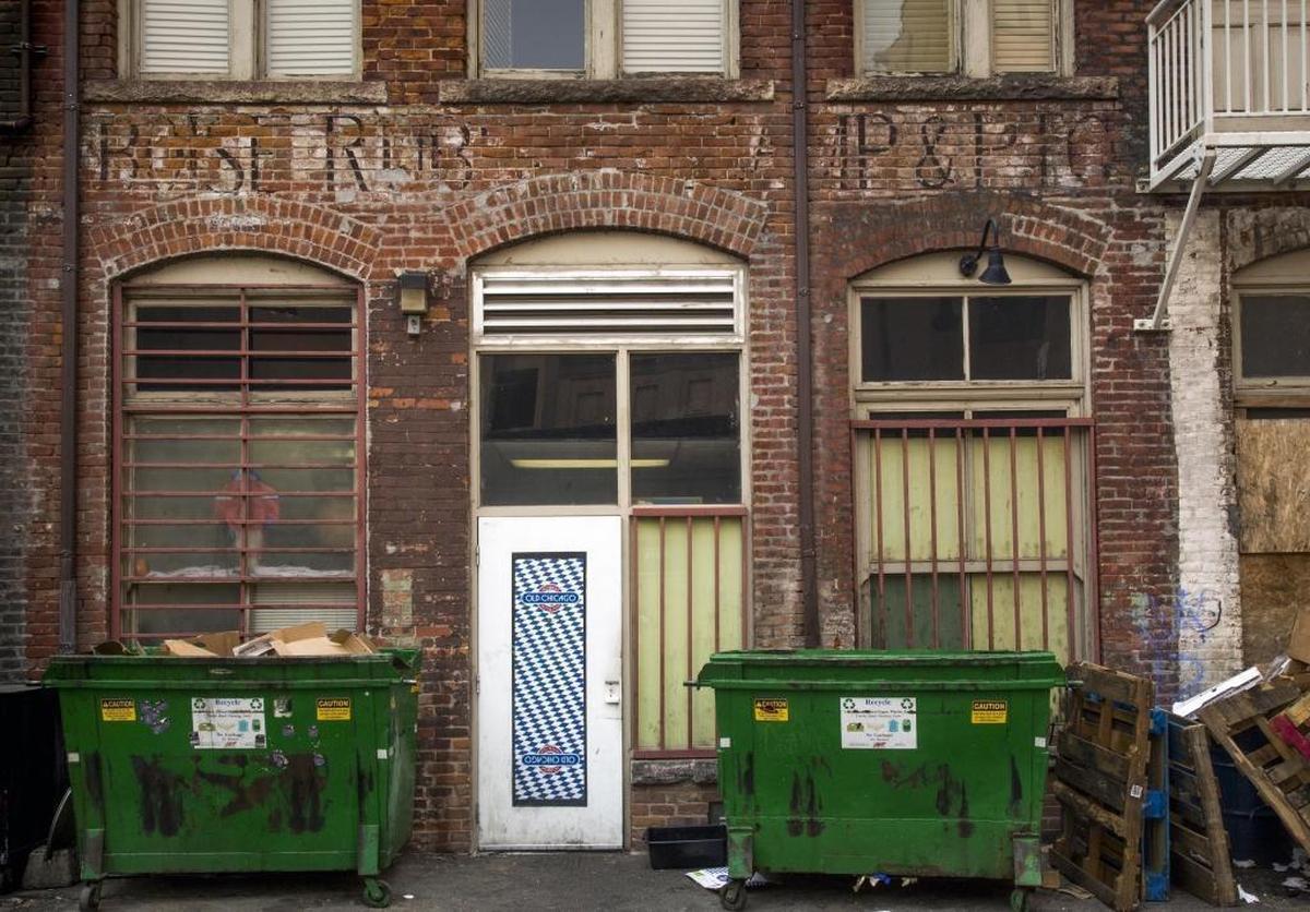 The Union Block, built in 1902, still shows remnants of its commercial past, including this faded “ghost sign” for a former stamp company. Historic elements like the sign, brick arched windows and sandstone foundations will remain, said Union Block property co-owner Anne Wescott.