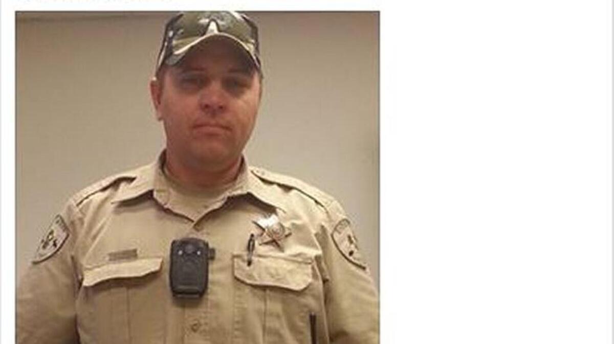 Deputy Cody Roland wears one of the new body cameras donated to the Adams County Sheriff’s Office in this July 29 Facebook post.