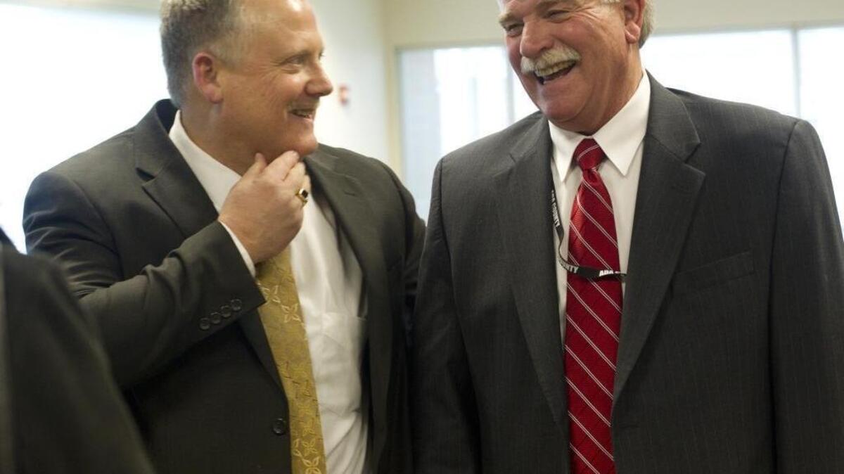 Ada County Commissioners Dave Case, left, and Jim Tibbs at their swearing-in ceremony on Jan. 14, 2013, at the Ada County Courthouse.