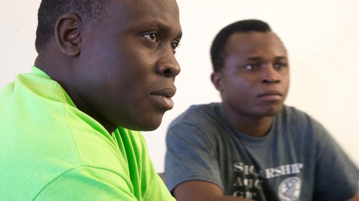 Refugee Bonane Basengelele, left, lost his father in the political upheaval of the Congo. The parents of Joli Ramadhan, right, were killed there too. With the help of resettlement agencies, both started new lives in Boise and landed jobs as janitors at Sage International School. Fewer refugees will settle in Boise this year under President Trump’s executive order on immigration.
