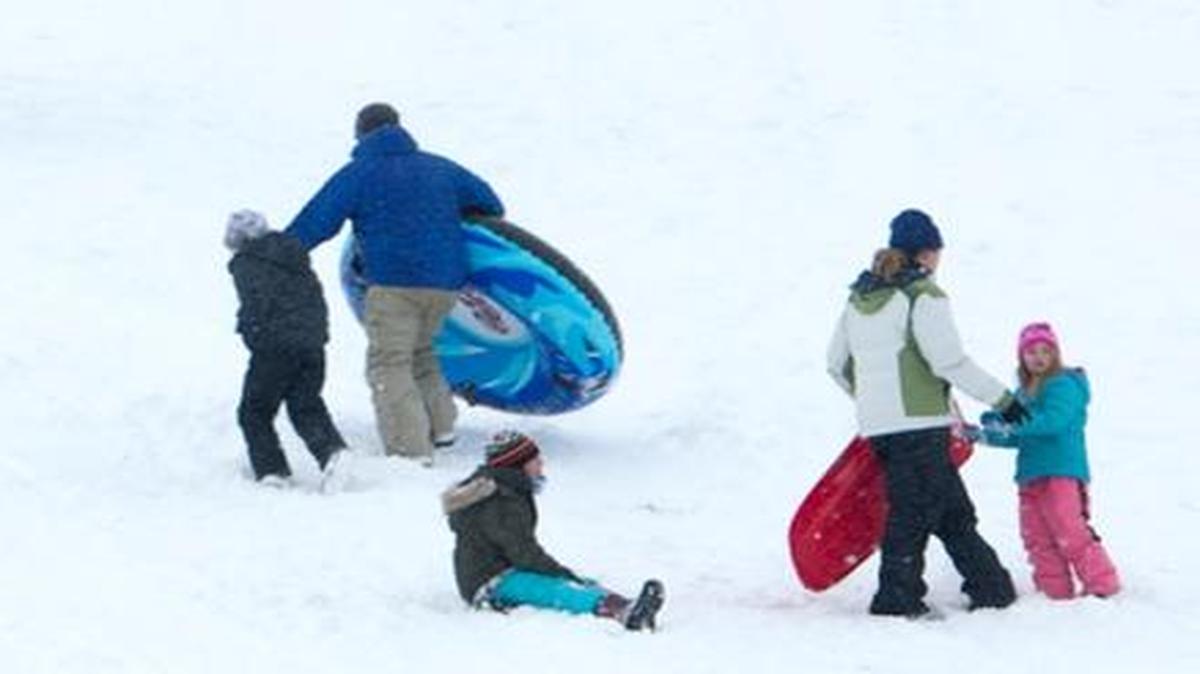 Kids and adults alike reveled in a white Christmas Eve at Simplot Hill.