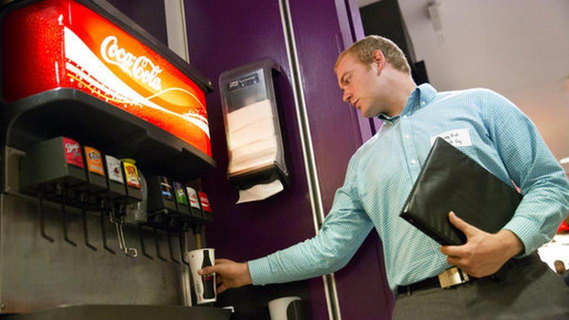 Greg Bird fills his cup with Coca Cola on campus at Brigham Young University on Thursday. Students were abuzz about a change that meant they’ll no longer have to make off-campus runs to load up on their favorite caffeinated sodas to jolt their sleep-deprived brains.