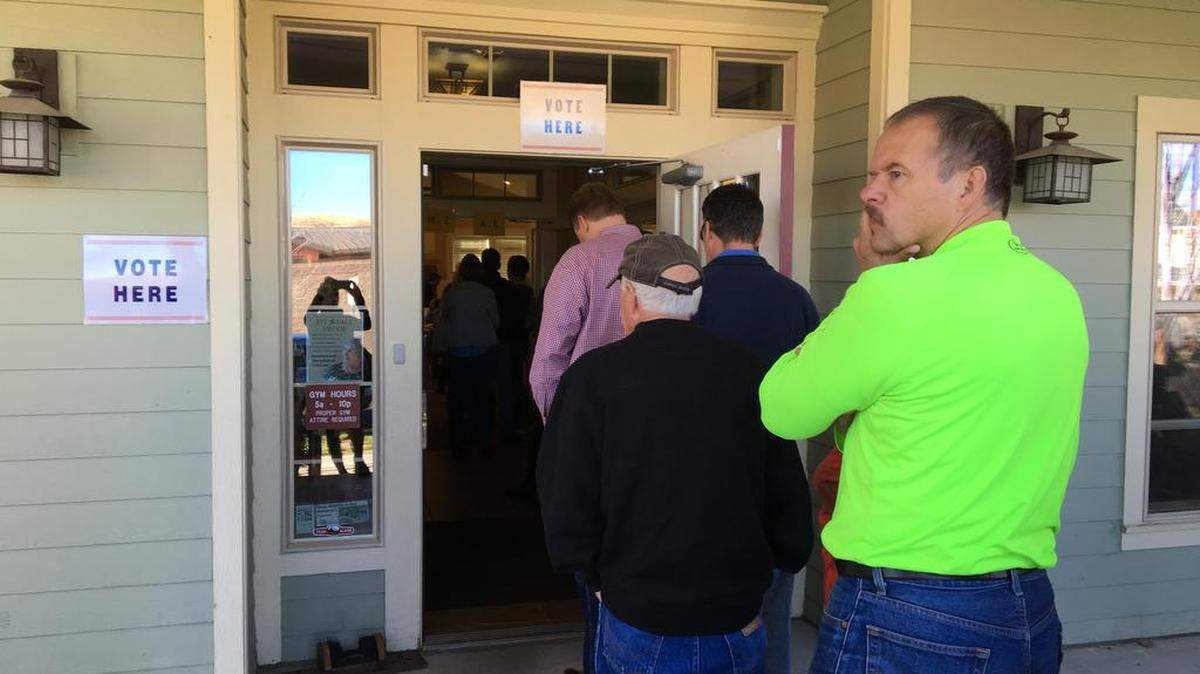 People wait to vote in the new polling place at the Hidden Springs Community Clubhouse.