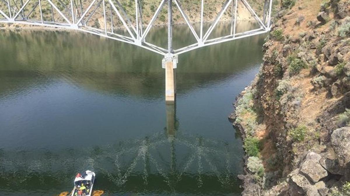 Members of the Ada County Sheriff’s Office dive team work to recover an SUV that landed Thursday morning in Lucky Peak Reservoir. The vehicle flew 50 to 70 feet over a cliff on Idaho 21 and landed in the water.