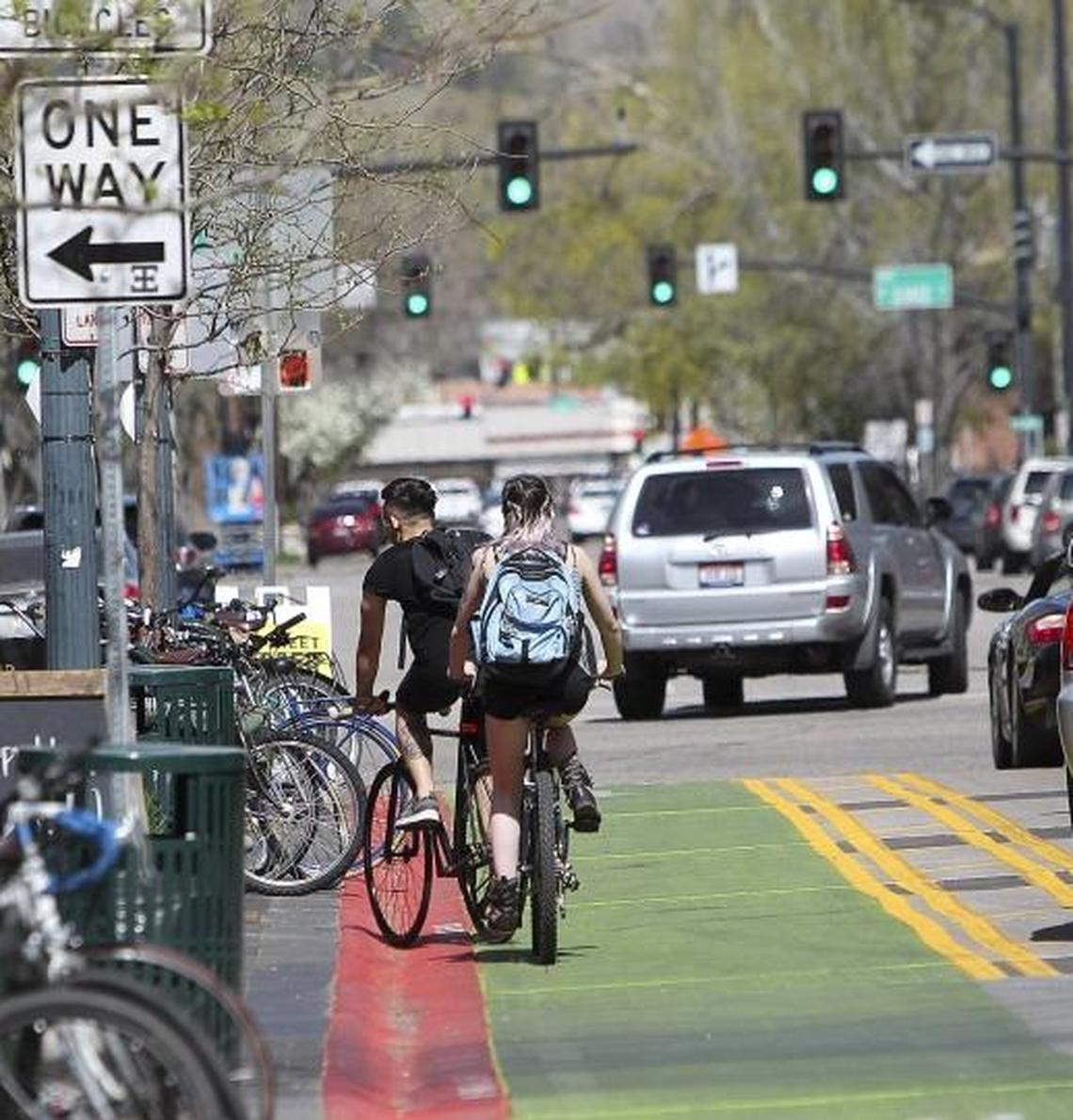 Bikers and cars make their way up N. 8th Street in downtown Boise, Idaho. The Boise Bicycle Project wants residents to reimagine some of the city’s streets as a haven for walkers and bikers.
