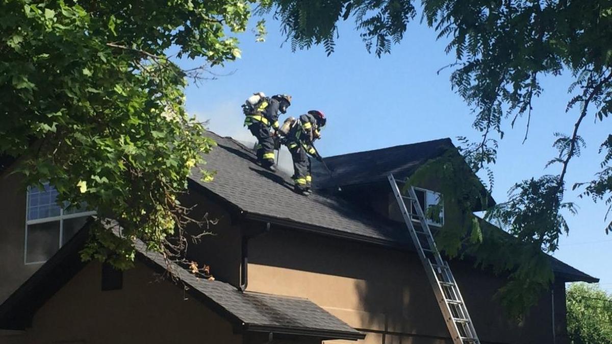 Boise firefighters work on a Thursday afternoon house fire on Pleasanton Avenue.