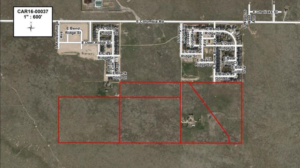 Boise developer Jim Conger’s original plan for Rush Valley, in the rectangles marked in red, would have provided only one street connection to Columbia Road at the top of this aerial photo: an extension of Snow Bird Avenue through the existing subdivision at the upper right. His latest proposal would use a future extension of Oregon Ridge Avenue, west of Snow Bird, as a second access road.