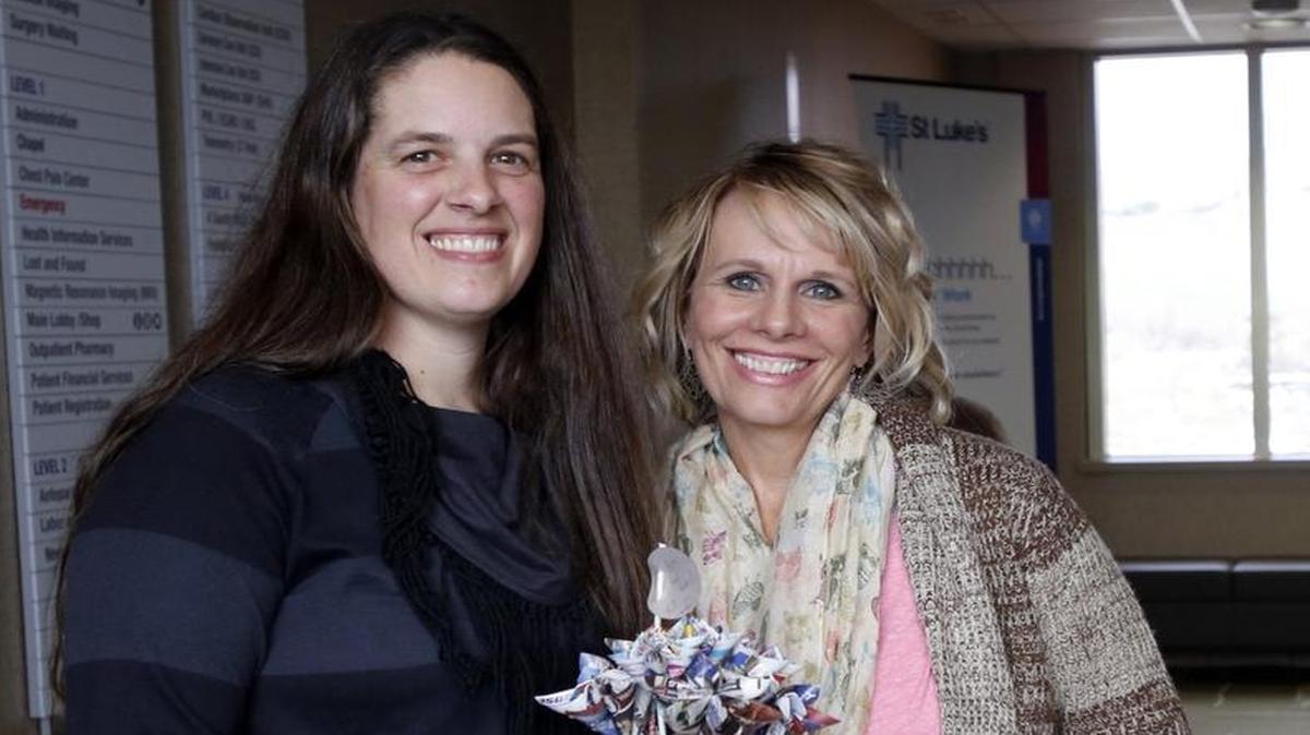 Idaho Statesman carrier Jennifer Anderson met Kim Gray, the granddaughter of 96-year-old Melvin Williamson, at St. Luke's downtown on Friday afternoon. Anderson alerted police after she noticed that Williamson's door has been propped open for two days while she was delivering the newspaper. Williamson is now recovering having fallen and spending two days on the floor and unable to summon help. Anderson made a bouquet of "flowers" made out of newspaper advertisements to share with Williamson's family.
