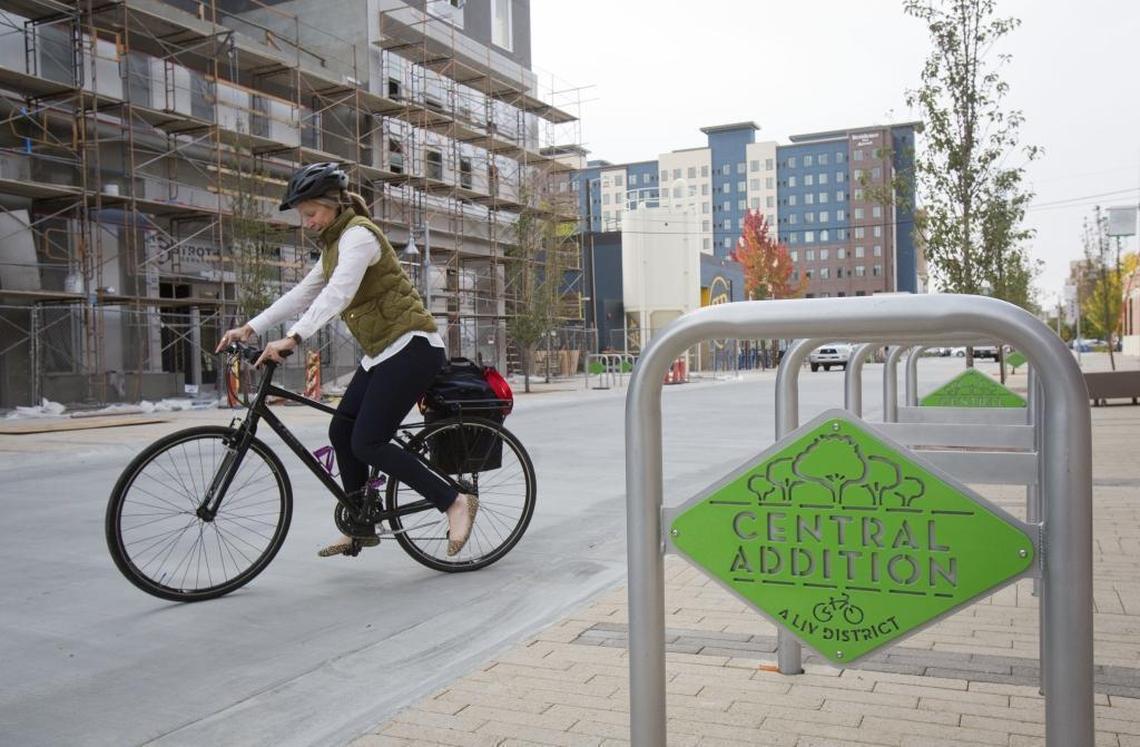 Maureen Braley finishes up a meeting at the Concordia University School of Law in Boise's new Central Addition LIV District and gets on her bike. "I love bike commuting," she says. She likes the new bike racks, at right, in the neighborhood, "and the nice, open community feel," she says, adding that there's a good flow between pedestrians and the street.