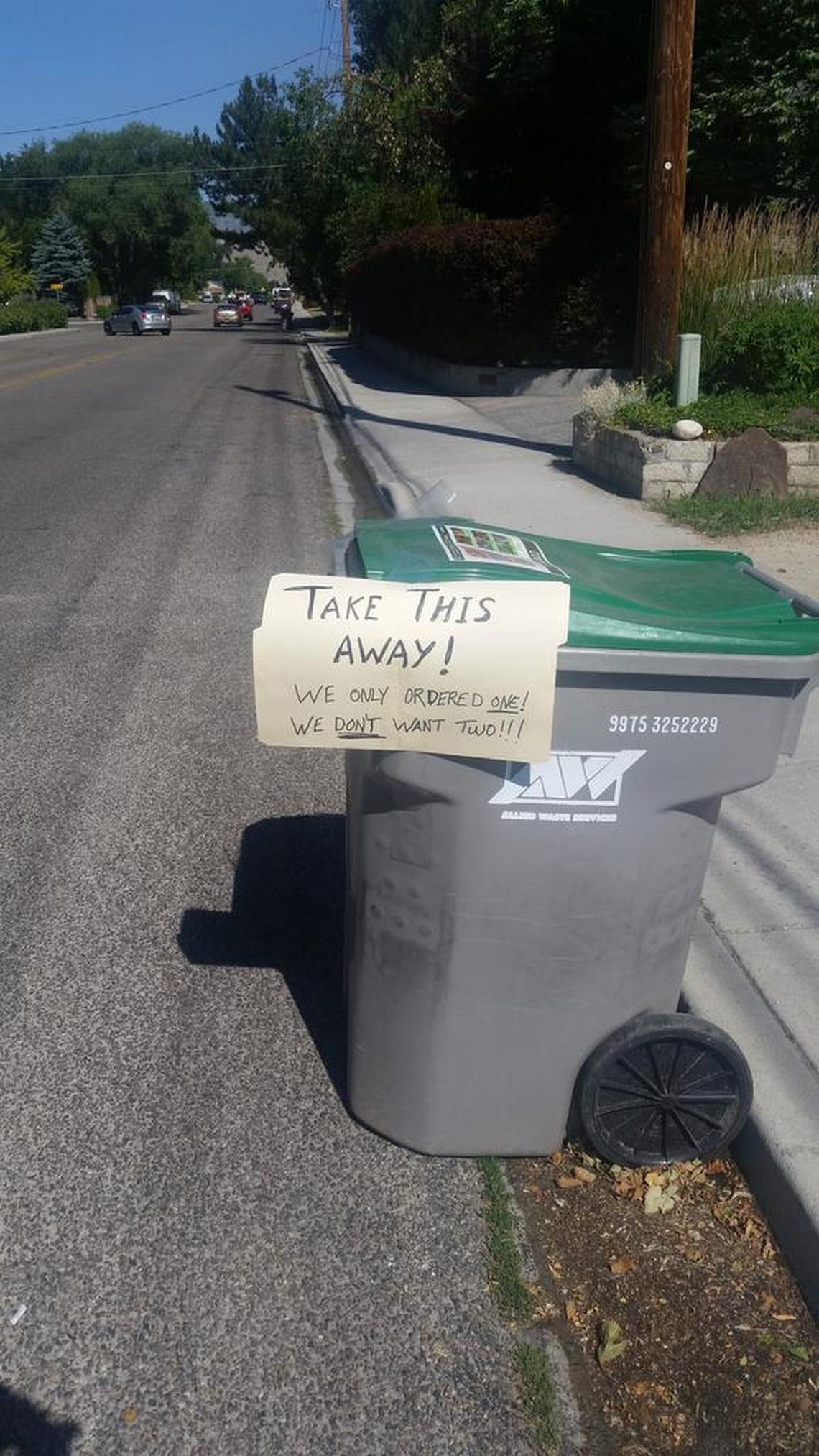 A compost cart delivered, perhaps mistakenly, to a house on Rose Hill Street waits to be picked up.