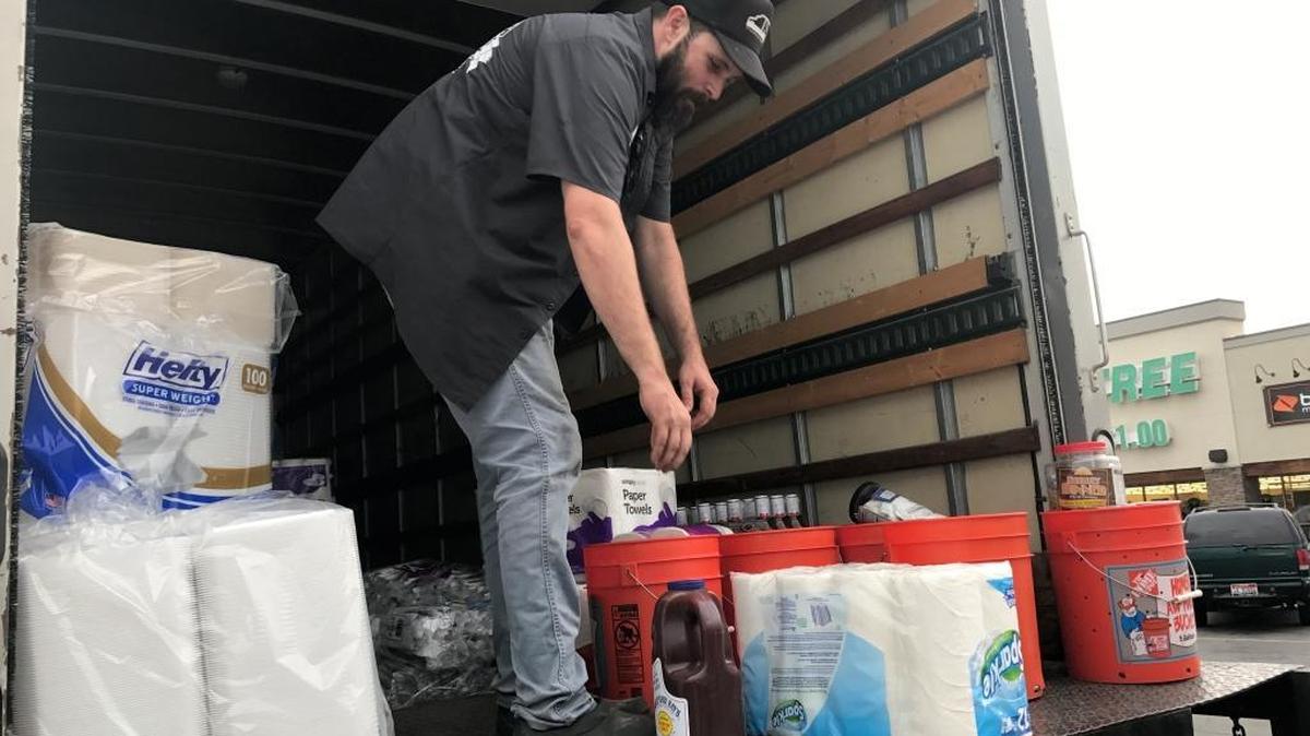Staff with BBQ4Life are collecting and delivering food and other items to flood victims.